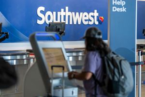 A traveler at a self-service kiosk in the Southwest Airlines check-in area at the San Francisco Bay Oakland International Airport in Oakland, California, Oct. 21, 2024.