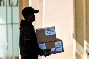 A UPS worker delivers packages in San Francisco, California, US, on Monday, Apr 28, 2025.