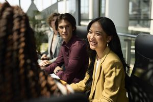 A smiling young woman in an office